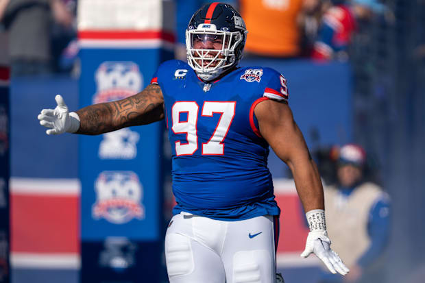 DT Dexter Lawrence II runs out of the tunnel prior to the game between the New York Giants and the Washington Commanders.
