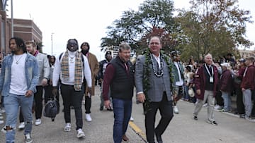 Nov 30, 2024; College Station, Texas, USA; Texas A&M Aggies head coach Mike Elko walks in with players before the game against the Texas Longhorns at Kyle Field. Mandatory Credit: Troy Taormina-Imagn Images