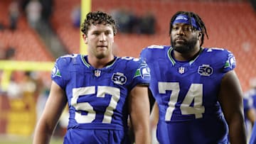 Nov 2, 2025; Landover, Maryland, USA; Seattle Seahawks linebacker Connor O'Toole (57) and Seahawks guard Josh Jones (74) walk off the field after defeating the Washington Commanders at Northwest Stadium. Mandatory Credit: Amber Searls-Imagn Images