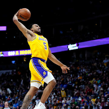 Jan 15, 2022; Denver, Colorado, USA; Los Angeles Lakers guard Talen Horton-Tucker (5) goes for a dunk in the second half against the Denver Nuggets at Ball Arena. Mandatory Credit: Ron Chenoy-Imagn Images