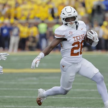 Sep 7, 2024; Ann Arbor, Michigan, USA;  Texas Longhorns running back Quintrevion Wisner (26) rushes in the first half against the Michigan Wolverines at Michigan Stadium. Mandatory Credit: Rick Osentoski-Imagn Images