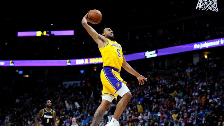 Jan 15, 2022; Denver, Colorado, USA; Los Angeles Lakers guard Talen Horton-Tucker (5) goes for a dunk in the second half against the Denver Nuggets at Ball Arena. Mandatory Credit: Ron Chenoy-USA TODAY Sports