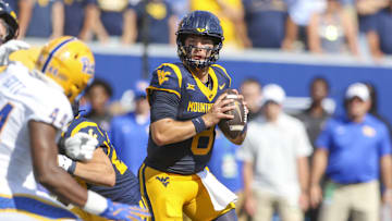 Sep 13, 2025; Morgantown, West Virginia, USA; West Virginia Mountaineers quarterback Nicco Marchiol (8) drops back to pass during the first quarter against the Pittsburgh Panthers at Milan Puskar Stadium. Mandatory Credit: Ben Queen-Imagn Images