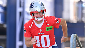 Jul 23, 2025; Foxborough, MA, USA; New England Patriots quarterback Drake Maye (10) runs out to the practice fields for day one of training camp at Gillette Stadium. Mandatory Credit: Eric Canha-Imagn Images
