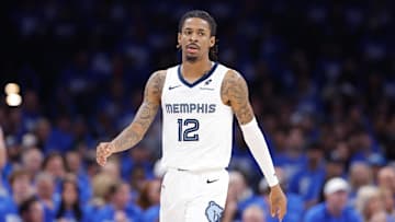 Apr 22, 2025; Oklahoma City, Oklahoma, USA; Memphis Grizzlies guard Ja Morant (12) walks down the court in the third quarter of game two of first round for the 2024 NBA Playoffs against the Oklahoma City Thunder at Paycom Center. Mandatory Credit: Alonzo Adams-Imagn Images