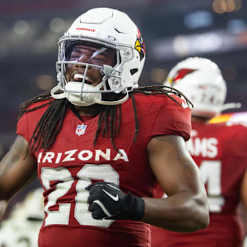 Aug 10, 2024; Glendale, Arizona, USA; Arizona Cardinals running back DeeJay Dallas (20) celebrates against the New Orleans Saints during a preseason NFL game at State Farm Stadium. Mandatory Credit: Mark J. Rebilas-Imagn Images
