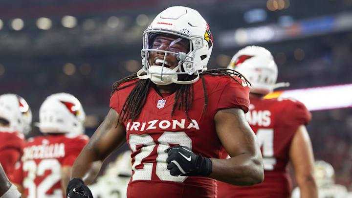 Aug 10, 2024; Glendale, Arizona, USA; Arizona Cardinals running back DeeJay Dallas (20) celebrates against the New Orleans Saints during a preseason NFL game at State Farm Stadium. Mandatory Credit: Mark J. Rebilas-Imagn Images
