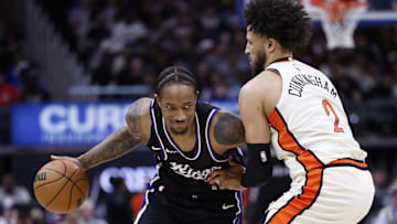 Apr 7, 2025; Detroit, Michigan, USA;  Sacramento Kings forward DeMar DeRozan (10) dribbles defended by Detroit Pistons guard Cade Cunningham (2) in the first half at Little Caesars Arena. Mandatory Credit: Rick Osentoski-Imagn Images