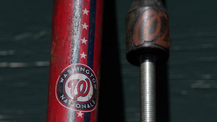 Aug 10, 2025; San Francisco, California, USA; The Washington Nationals logo appears on a fungo bat in the dugout before the game against the San Francisco Giants at Oracle Park. Mandatory Credit: Darren Yamashita-Imagn Images