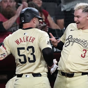 Sep 10, 2024; Phoenix, Arizona, USA; Arizona Diamondbacks first base Christian Walker (53) celebrates with Joc Pederson (3) after hitting a solo home run against the Texas Rangers in the first inning at Chase Field. Mandatory Credit: Rick Scuteri-Imagn Images