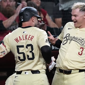 Sep 10, 2024; Phoenix, Arizona, USA; Arizona Diamondbacks first base Christian Walker (53) celebrates with Joc Pederson (3) after hitting a solo home run against the Texas Rangers in the first inning at Chase Field. Mandatory Credit: Rick Scuteri-Imagn Images