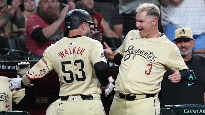 Sep 10, 2024; Phoenix, Arizona, USA; Arizona Diamondbacks first base Christian Walker (53) celebrates with Joc Pederson (3) after hitting a solo home run against the Texas Rangers in the first inning at Chase Field. Mandatory Credit: Rick Scuteri-Imagn Images