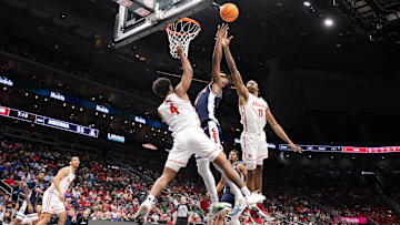 Mar 15, 2025; Kansas City, MO, USA; Arizona Wildcats guard Jaden Bradley (0) shoots the ball over Houston Cougars guard L.J. Cryer (4) during the second half for the Big 12 Conference Tournament Championship game at T-Mobile Center. Mandatory Credit: William Purnell-Imagn Images