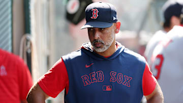 Jun 25, 2025; Anaheim, California, USA;  Boston Red Sox manager Alex Cora (13) looks down in the dugout during the eighth inning against the Los Angeles Angels at Angel Stadium. Mandatory Credit: Kiyoshi Mio-Imagn Images