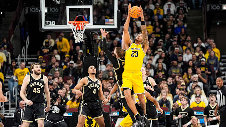 Michigan forward Yaxel Lendeborg (23) grabs a rebound against Purdue guard Braden Smith (3) during the first half of Big Ten Tournament final at United Center in Chicago on Sunday, March 15, 2026.
