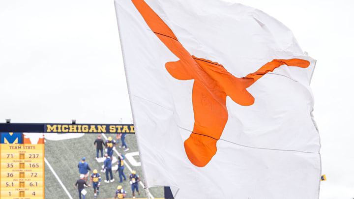 Texas wave their flag to celebrates a touchdown against Michigan during the first half at Michigan Stadium in Ann Arbor on Saturday, September 7, 2024.