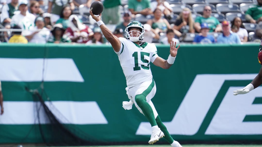 Aug 10, 2024; East Rutherford, New Jersey, USA; New York Jets quarterback Adrian Martinez (15) throws a deep pass during the second half against the Washington Commanders at MetLife Stadium. 