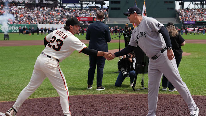 Mar 27, 2026; San Francisco, California, USA; San Francisco Giants manager Tony Vitello (23) and New York Yankees manager Aaron Boone (right) shake hands before the game at Oracle Park. Mandatory Credit: Darren Yamashita-Imagn Images