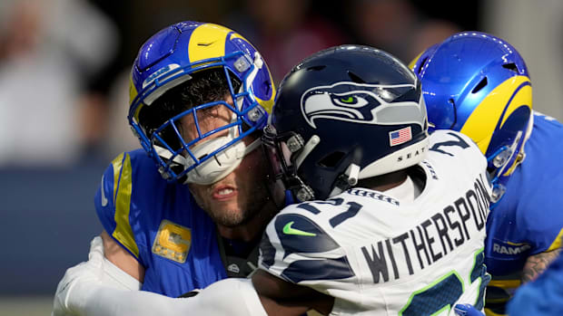 Seattle Seahawks cornerback Devon Witherspoon sacks Los Angeles Rams quarterback Matthew Stafford. 