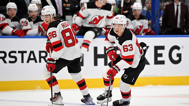 Jan 16, 2025; Toronto, Ontario, CAN;  New Jersey Devils forward Jesper Bratt (63) skates with the puck beside forward Jack Hughes (86) against the Toronto Maple Leafs in the first period at Scotiabank Arena. Mandatory Credit: Dan Hamilton-Imagn Images