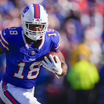 Buffalo Bills wide receiver Amari Cooper runs with the ball after making a catch against the Tennessee Titans.