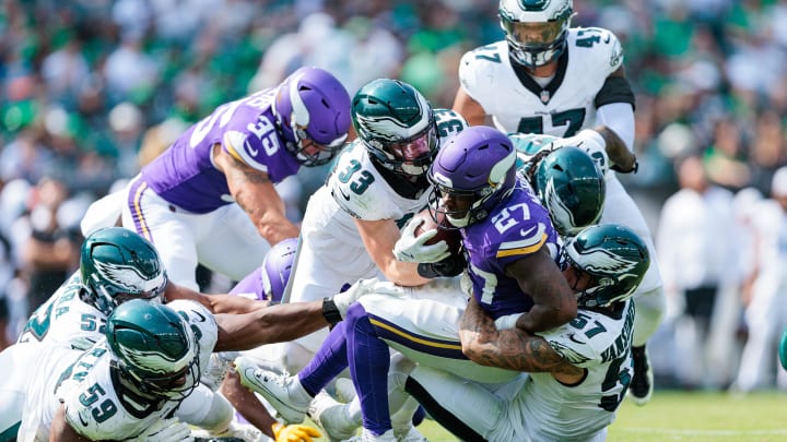 Aug 24, 2024; Philadelphia, Pennsylvania, USA; Minnesota Vikings running back DeWayne McBride (27) is brought down by Philadelphia Eagles linebacker Ben VanSumeren (57) and defensive tackle Thomas Booker IV (59) during the fourth quarter at Lincoln Financial Field. Mandatory Credit: Caean Couto-USA TODAY Sports