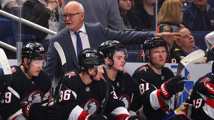 Buffalo Sabres players and head coach Lindy Ruff