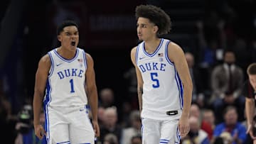 Mar 15, 2025; Charlotte, NC, USA; Duke basketball guard Caleb Foster (1) and guard Tyrese Proctor (5) celebrate after a play in the first half of the 2025 ACC Conference Championship game against the Louisville Cardinals at Spectrum Center.
