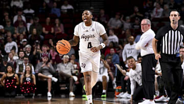 Dec 28, 2024; College Station, Texas, USA; Texas A&M Aggies guard Wade Taylor IV (4) dribbles the ball during the first half against the Abilene Christian Wildcats at Reed Arena. Mandatory Credit: Maria Lysaker-Imagn Images 