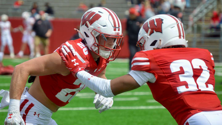 Wisconsin freshman safeties Luke Emmerich, left, and Remington Moss participate in a drill before the Badgers spring football scrimmage April 19. Wisconsin freshman safeties Luke Emmerich, left, and Remington Moss participate in a drill before the Badgers spring football scrimmage April 19.