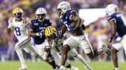 Sep 28, 2024; Baton Rouge, Louisiana, USA;  South Alabama Jaguars wide receiver Jamaal Pritchett (2) runs after a catch against LSU Tigers cornerback Jyaire Brown (17) during the second quarter at Tiger Stadium. Mandatory Credit: Stephen Lew-Imagn Images