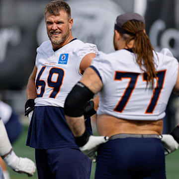 Jul 26, 2024; Englewood, CO, USA; Denver Broncos offensive tackle Mike McGlinchey (69) and guard Ben Powers (74) and guard Quinn Meinerz (77) during training camp at Broncos Park Powered by CommonSpirit. Mandatory Credit: Isaiah J. Downing-Imagn Images