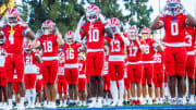 Mater Dei football players warm up before taking on Corona Centennial in 2024 season opener.