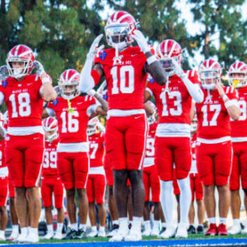 Mater Dei football players warm up before taking on Corona Centennial in 2024 season opener.