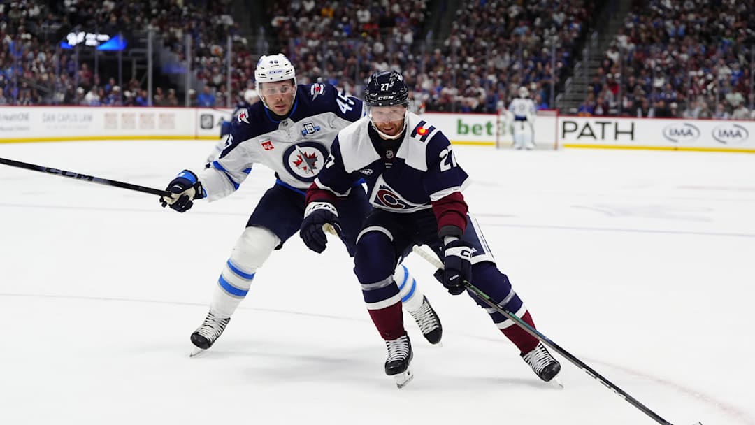 Mar 28, 2026; Denver, Colorado, USA; Winnipeg Jets left wing Cole Koepke (45) defends on Colorado Avalanche center Alex Barre-Boulet (27) in the third period at Ball Arena. Mandatory Credit: Ron Chenoy-Imagn Images