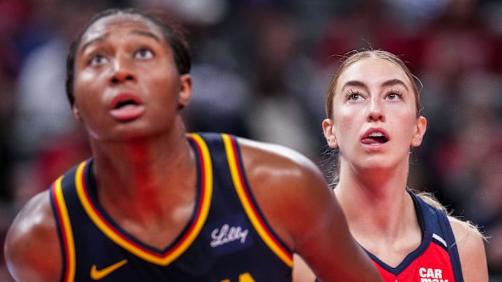 Indiana Fever Aliyah Boston (7) and Washington Mystics Lucy Olsen (33) watch the ball Saturday, May 3, 2025, during a free throw at a preseason game between the Indiana Fever and the Washington Mystics at Gainbridge Fieldhouse in Indianapolis. The Indiana Fever defeated the Washington Mystics in overtime, 79-74.