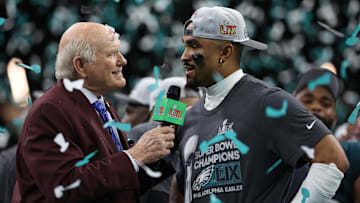 Fox sports' Terry Bradshaw interviews Philadelphia Eagles star Jalen Hurts during the trophy presentation at Super Bowl LIX