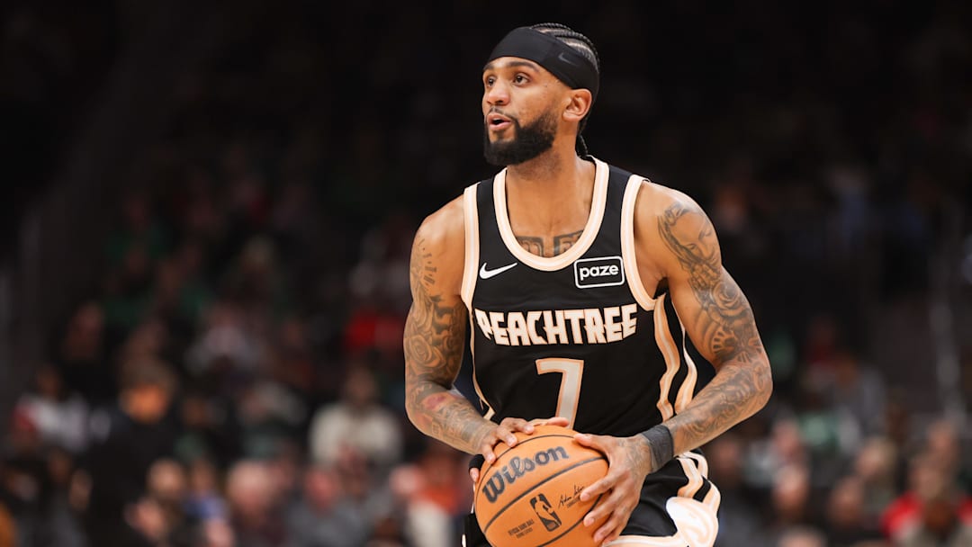 Jan 17, 2026; Atlanta, Georgia, USA; Atlanta Hawks guard Nickeil Alexander-Walker (7) shoots against the Boston Celtics in the first quarter at State Farm Arena. Mandatory Credit: Brett Davis-Imagn Images
