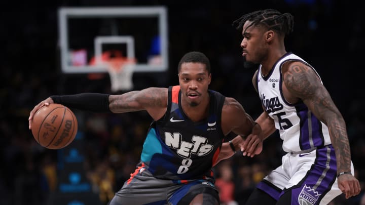 Apr 7, 2024; Brooklyn, New York, USA; Brooklyn Nets guard Lonnie Walker IV (8) dribbles against Sacramento Kings guard Davion Mitchell (15) during the second half at Barclays Center. Mandatory Credit: Vincent Carchietta-USA TODAY Sports