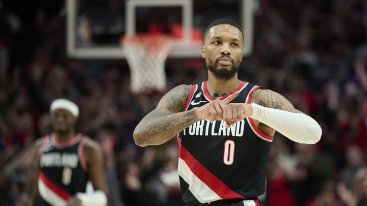 Portland Trail Blazers guard Damian Lillard (0) celebrates during the second half after scoring a three point basket against the Denver Nuggets at Moda Center in 2022. The Nuggets won the game 121-120. 