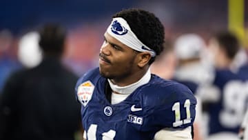 Dec 31, 2024; Glendale, AZ, USA; Penn State Nittany Lions defensive end Abdul Carter (11) reacts after suffering an injury against the Boise State Broncos in the Fiesta Bowl at State Farm Stadium. Mandatory Credit: Mark J. Rebilas-Imagn Images