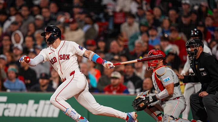 May 12, 2026; Boston, Massachusetts, USA; Boston Red Sox shortstop Trevor Story (10) hits a single against the Philadelphia Phillies in the seventh inning at Fenway Park. Mandatory Credit: David Butler II-Imagn Images