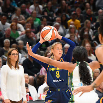 Aug 3, 2025; Seattle, Washington, USA; Indiana Fever guard Sophie Cunningham (8) looks to pass the ball against the Seattle Storm during the first half at Climate Pledge Arena. Mandatory Credit: Steven Bisig-Imagn Images