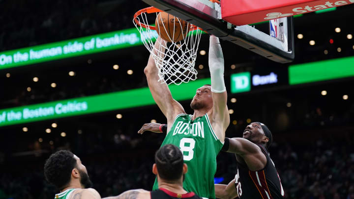 Apr 24, 2024; Boston, Massachusetts, USA; Boston Celtics center Kristaps Porzingis (8) makes the dunk against the Miami Heat in Game 3 of Eastern Conference playoffs - David Butler II/USA TODAY Sports