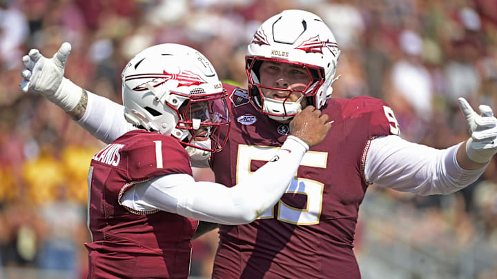 Sep 20, 2025; Tallahassee, Florida, USA; Florida State Seminoles quarterback Thomas Castellanos (1) celebrates with offensive lineman Gunnar Hansen (55) during the first half against the Kent State Golden Flashes at Doak S. Campbell Stadium. Mandatory Credit: Melina Myers-Imagn Images Sep 20, 2025; Tallahassee, Florida, USA; Florida State Seminoles quarterback Thomas Castellanos (1) celebrates with offensive lineman Gunnar Hansen (55) during the first half against the Kent State Golden Flashes at Doak S. Campbell Stadium. Mandatory Credit: Melina Myers-Imagn Images