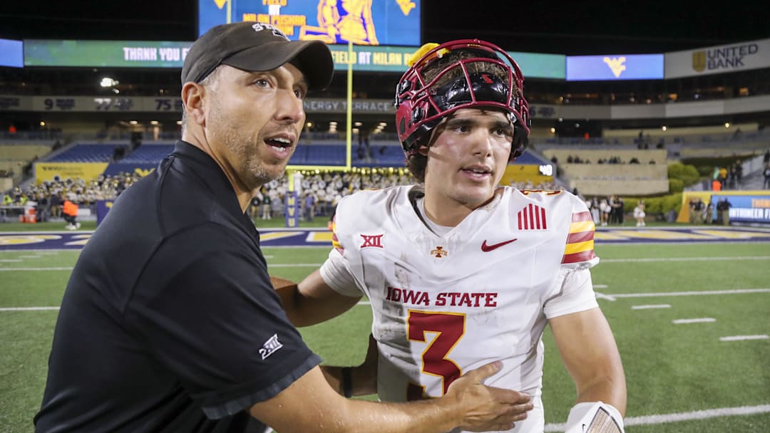 Oct 12, 2024; Morgantown, West Virginia, USA; Iowa State Cyclones head coach Matt Campbell celebrates with quarterback Rocco Becht (3) after defeating the West Virginia Mountaineers at Mountaineer Field at Milan Puskar Stadium. Mandatory Credit: Ben Queen-Imagn Images