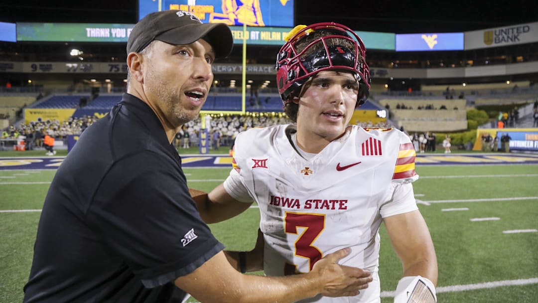 Iowa State Cyclones head coach Matt Campbell celebrates with quarterback Rocco Becht (3) after defeating the West Virginia Mountaineers at Mountaineer Field at Milan Puskar Stadium.