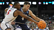 Mar 24, 2024; Spokane, WA, USA; Yale Bulldogs guard John Poulakidas (4) battles San Diego State Aztecs guard Lamont Butler (5) for the ball in the second half at Spokane Veterans Memorial Arena. Mandatory Credit: Kirby Lee-Imagn Images