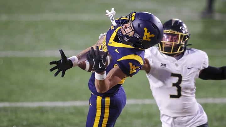 Nov 23, 2024; Morgantown, West Virginia, USA; West Virginia Mountaineers wide receiver Rodney Gallagher III (24) makes a catch for a touchdown against the UCF Knights during the second quarter at Mountaineer Field at Milan Puskar Stadium. Mandatory Credit: Ben Queen-Imagn Images