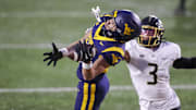 Nov 23, 2024; Morgantown, West Virginia, USA; West Virginia Mountaineers wide receiver Rodney Gallagher III (24) makes a catch for a touchdown against the UCF Knights during the second quarter at Mountaineer Field at Milan Puskar Stadium. Mandatory Credit: Ben Queen-Imagn Images